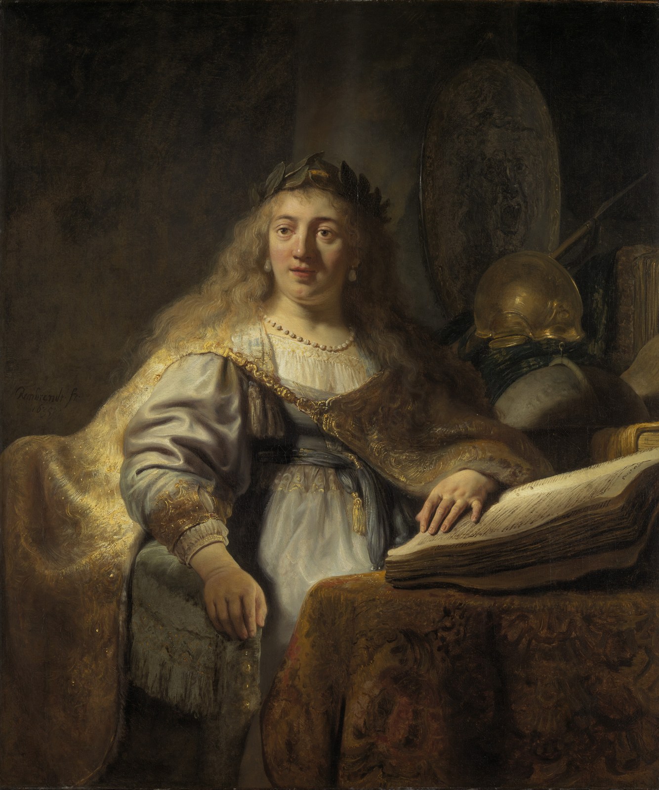 Rembrandt's 1635 painting of Minerva, goddess of wisdom, seated at a desk with a large open book, a laurel wreath and a globe.