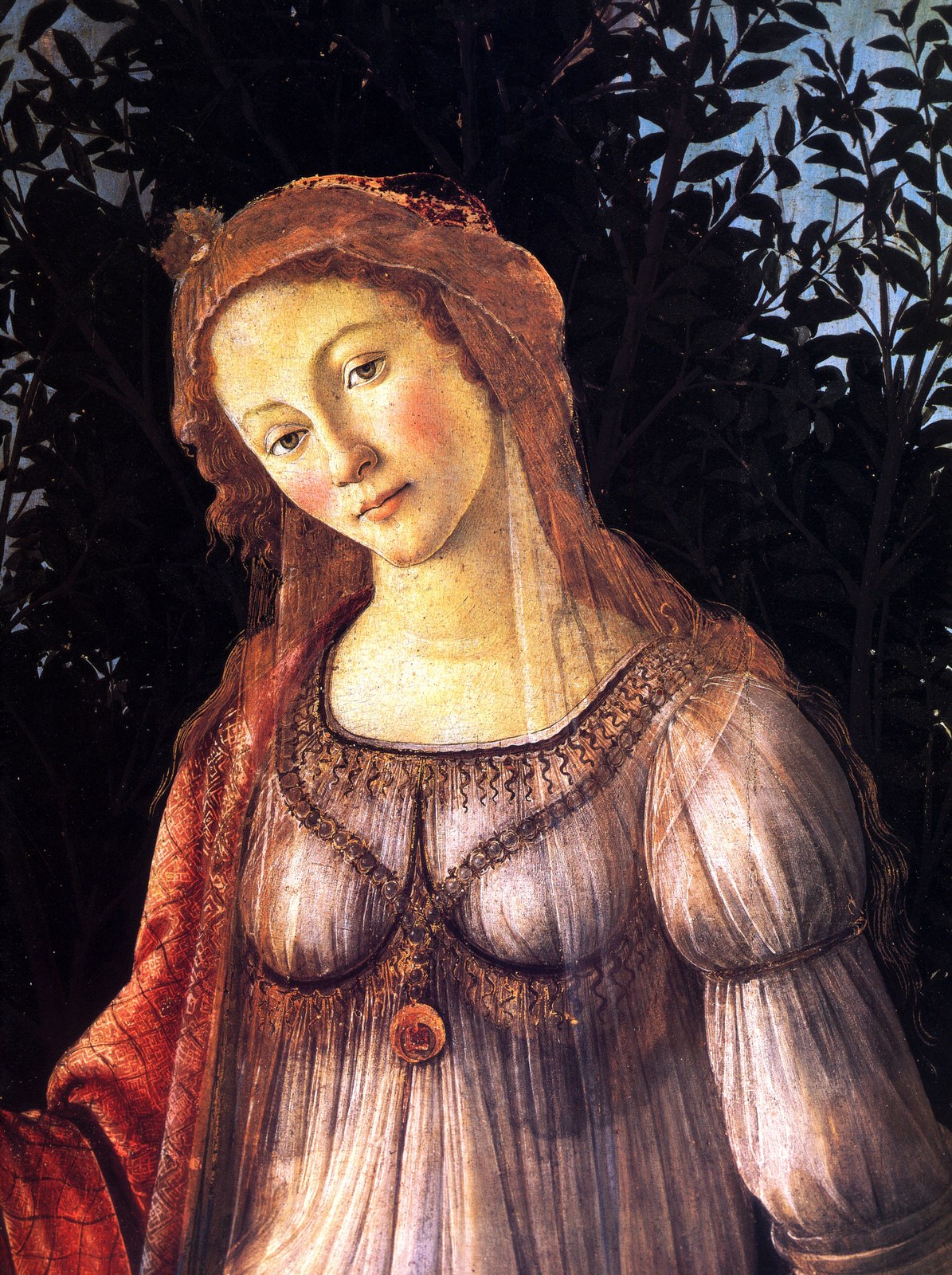 Detail of Botticelli's Primavera: Venus in a white veil and gown, head tilted, against dark orange-tree leaves.